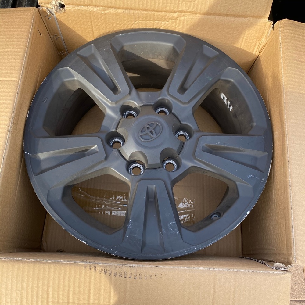 Toyota Tacoma stock sport rims.